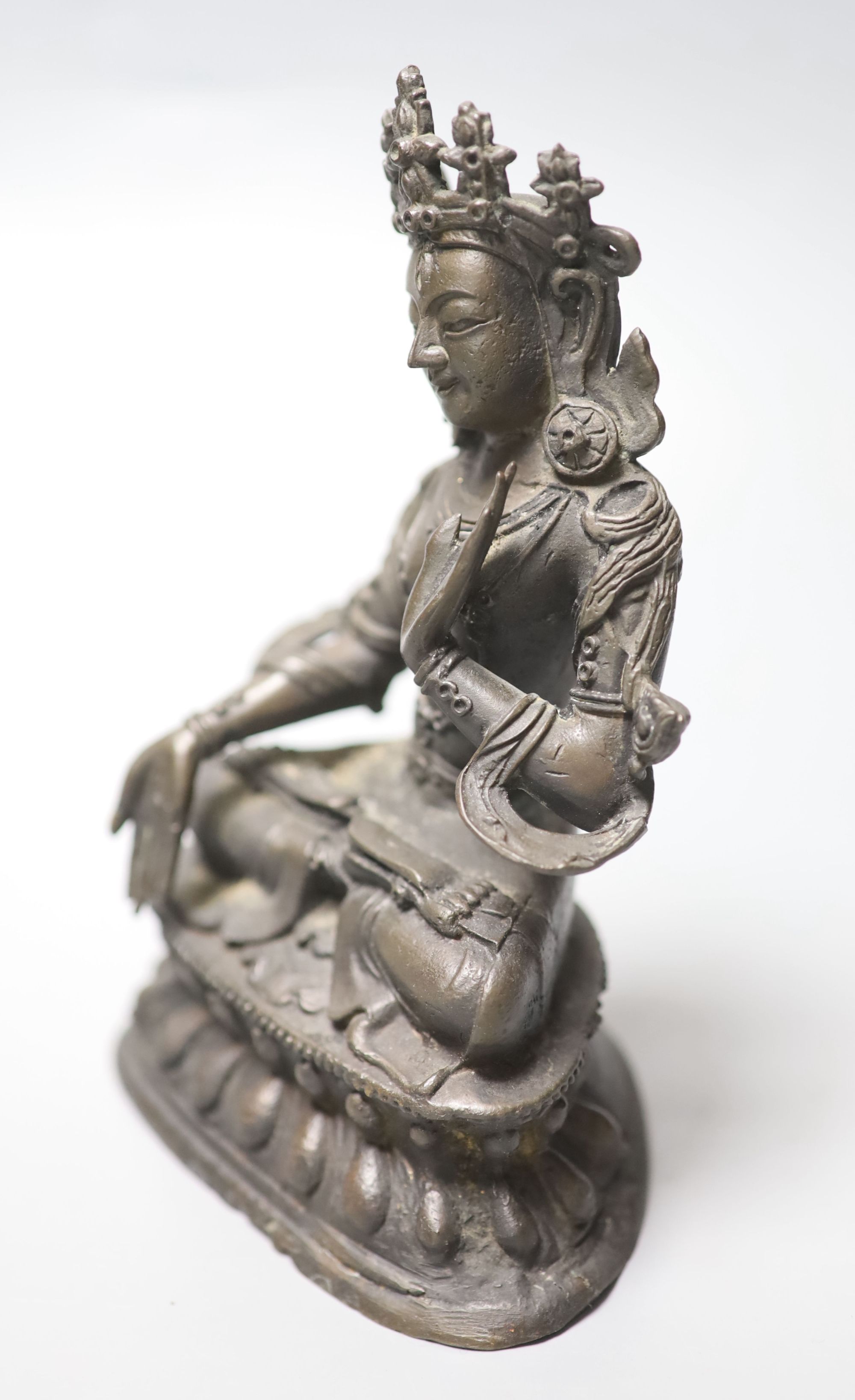 A Chinese or Sino-Tibetan bronze seated Buddha, possibly 18th century, height 16.5cm